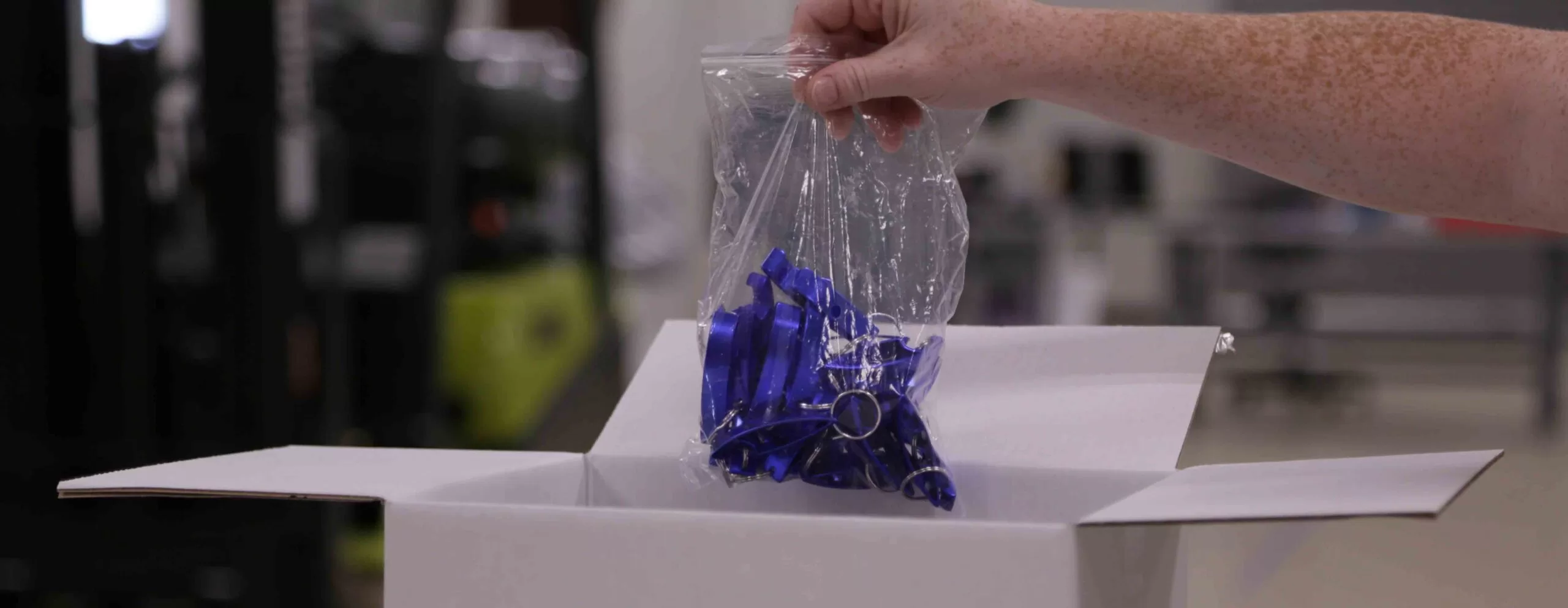 employee receiving parts out of a box